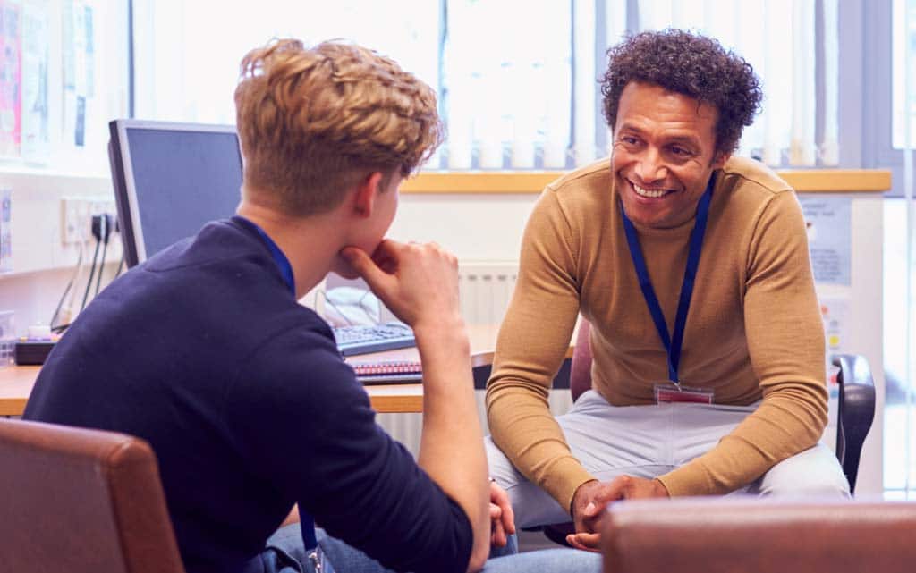 man-mentoring-youth